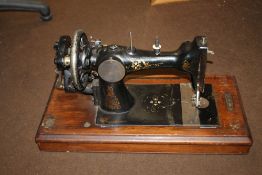 A CASED SEWING MACHINE