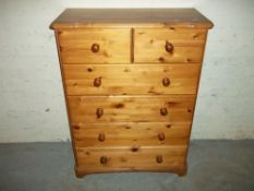 A SOLID PINE CHEST OF DRAWS, TWO OVER FOUR
