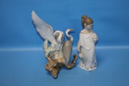 A NAO FIGURINE AND A HERON GROUP