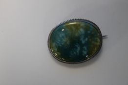 A CHARLES HORNER AND RUSKIN SILVER BROOCH