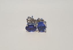 A PAIR OF TANZANITE SILVER STUDS