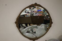 A FRAMED AND GLAZED CIRCULAR MIRROR APPROX. 72 X 72 CM