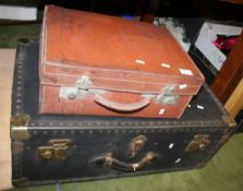 A BRASS BOUND TRUNK TOGETHER WITH A VINTAGE LEATHER SUITCASE