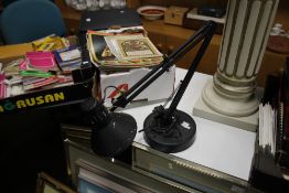 AN ANGLE POISED LAMP