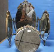 A CIRCULAR FRAMED FLORAL MIRROR TOGETHER WITH A DRESSING TABLE MIRROR