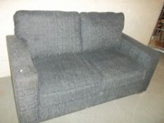 A FABRIC TWO SEATER SOFA