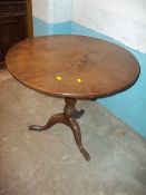 A GEOGIAN OAK ROUND FLIP TOP TABLE