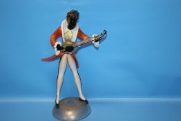 A GLASS MUSICIAN FIGURE