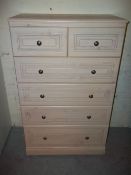 A 2 OVER 4 MODERN ALSTONS CHEST OF DRAWERS IN PINE EFFECT