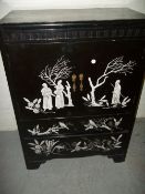 AN EMBOSSED JAPANESE THEMED STYLED DRINKS CABINET TALL BOY / CUPBOARD / CHEST WITH TWO DRAWS