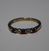 A 9 CT YELLOW GOLD FIVE STONE RUBY AND DIAMOND RING