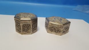 TWO CHINESE EXPORT WHITE METAL SNUFF/TRINKET BOXES, BOTH WITH TYPICAL EMBOSSED DECORATION, THE