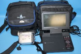 A TOSHIBA PORTABLE DVD PLAYER TOGETHER WITH A PANASONIC CAMERA