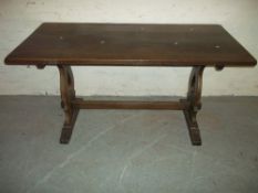 AN OAK FIXED DINING TABLE