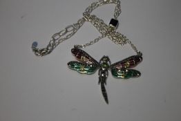 A SILVER PLIQUE-A-JOUR DAMSEL FLY NECKLACE SET WITH PERIDOT GARNETS, RUBIES AND MARCASITES