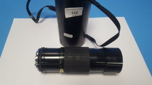 A SIGMA 70-250MM ZOOM LENS IN CASE