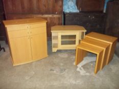 THREE ITEMS, AN OAK NEST OF THREE TABLES, A TV MEDIA UNIT STAND AND A MODERN SKOVBY BOW FRONTED