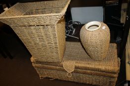 A WICKER STORAGE UNIT, WICKER STAND AND A WICKER VASE