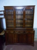 A LARGE OAK DISPLAY WALL UNIT