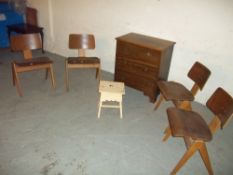 A TWO OVER TWO MAHOGANY CHEST OF DRAWS AND FOUR SCHOOL TYPE VINTAGE STACKABLE CHAIRS