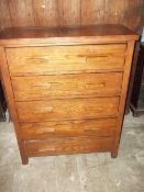 A WIDE TALL FIVE DRAWER CHEST IN MEDIEVAL OAK