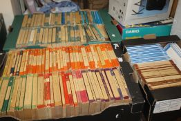 TWO LARGE TRAYS AND ONE SMALL TRAY OF PENGUIN AND PELICAN PAPERBACK BOOKS - ORANGE, GREEN, VIOLET