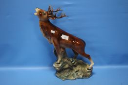 A CERAMIC STAG, APPROX. H 44 CM¦Condition Report:There is a small loss to the tip of one antler