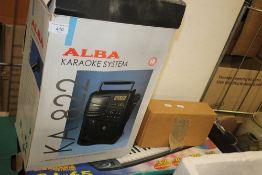 A CASIO KEYBOARD AND AN ALBA KAREOKE SYSTEM
