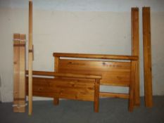 A DOUBLE SOLID PINE BED FRAME WITH FITTINGS