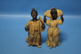 A PAIR OF 19TH CENTURY ORIENTAL STYLE NODDING FIGURES OF A LADY AND A GENTLEMAN