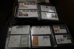 A QUANTITY OF FIRST DAY COVERS LOOSE AND IN ALBUMS