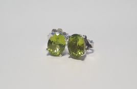 A PAIR OF PERIDOT SILVER STUDS