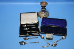 A QUANTITY OF SILVER ITEMS TO INCLUDE A CANDLESTICK, SPOONS, SUGAR TONGS ETC.