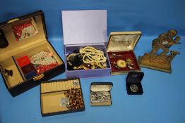 A QUANTITY OF COSTUME JEWELLERY, DOOR STOPS, ETC.