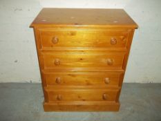 A SOLID PINE FOUR DRAW CHEST