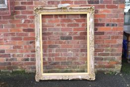 A 19TH CENTURY GOLD SWEPT FRAME WITH INTEGRAL SLIP A/F, frame W 10 cm, rebate approx 113 x 87 cm
