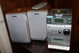 A MODERN SONY STEREO WITH REMOTE AND SPEAKERS