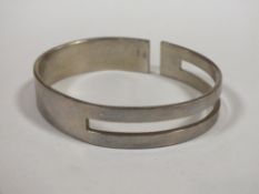 A WHITE METAL BANGLE
