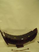 A 20TH CENTURY CARVED WOODEN XYLOPHONE