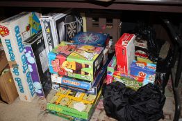 A LARGE QUANTITY OF BOARD GAMES, DART BOARD ETC.