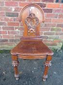 AN ANTIQUE WILLIAM IV OAK HALL CHAIR