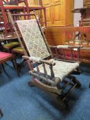 AN AMERICAN OAK ROCKING CHAIR