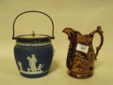 A WEDGWOOD LIDDED JASPERWARE CRACKER BARREL TOGETHER WITH A JUG
