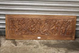 A LARGE TRIBAL STYLE CARVED HARD WOOD PANEL, 102 X 36 CM