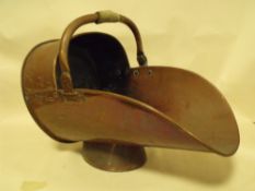 A LARGE COPPER COAL SCUTTLE