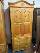 A HONEY PINE DOUBLE WARDROBE WITH 3 DRAWERS BELOW H 213 CM W 99 CM