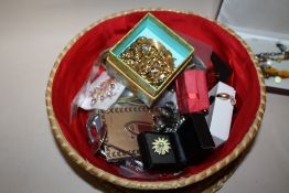 A BASKET OF COSTUME JEWELLERY