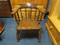 AN ANTIQUE TRADITIONAL ELM SMOKERS BOW ARMCHAIR