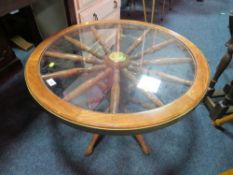 A RETRO SHIPS WHEEL GLASS COFFEE TABLE DIA. 76CM