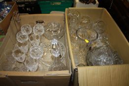 TWO TRAYS OF MOSTLY CUT GLASS TO INCLUDE A PAIR OF FLORALLY ETCHED GLASS VASES, DECANTERS ETC.